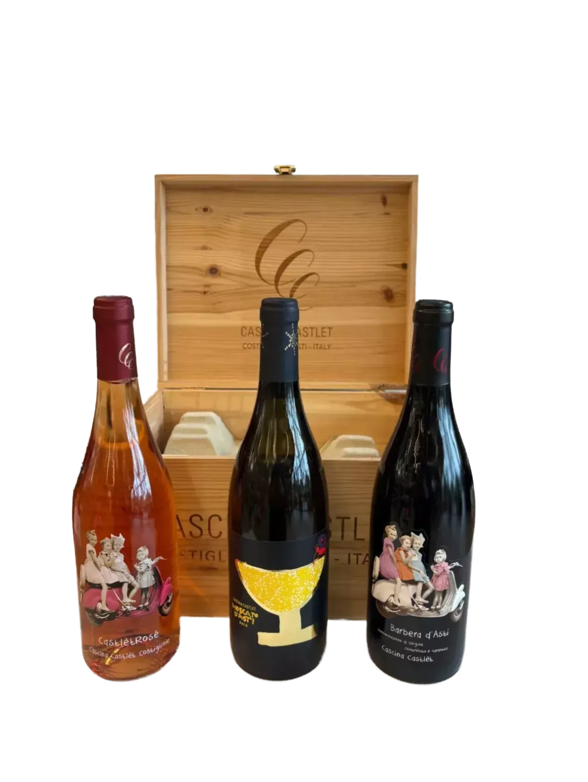 three bottles of wine, each with a unique label, placed in front of a wooden crate.
