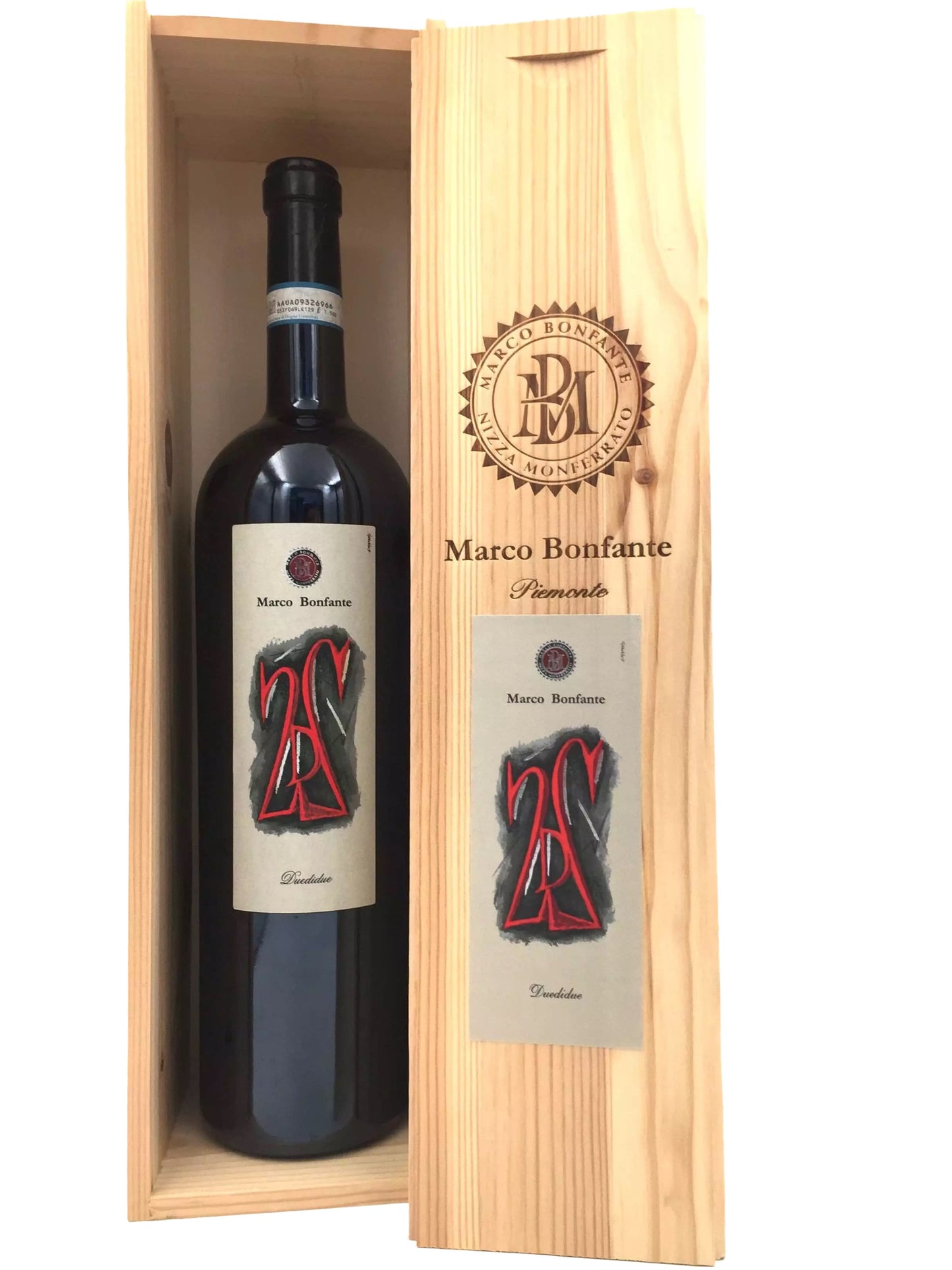 a bottle of red wine placed inside a wooden box.